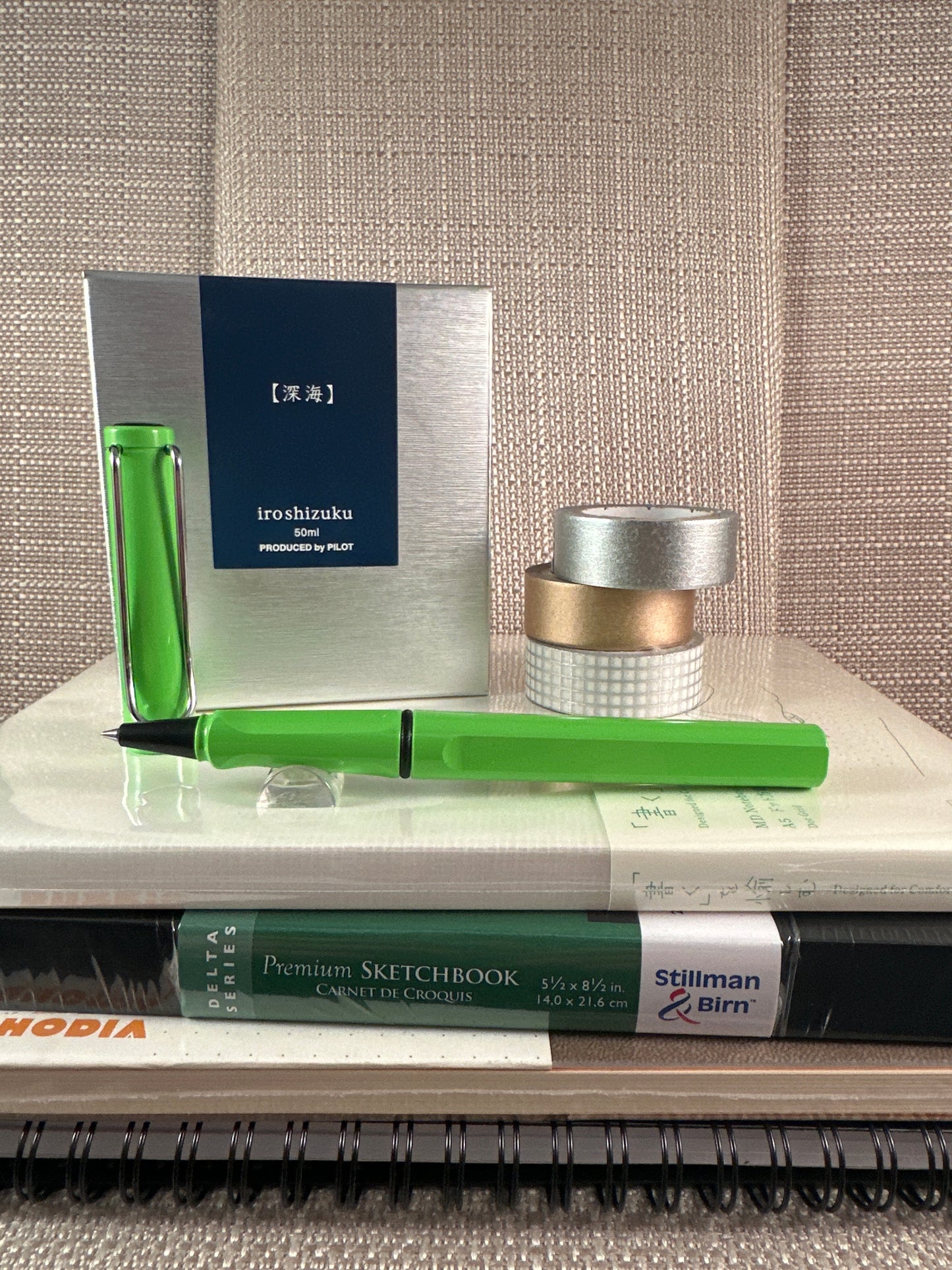 Lamy Safari Rollerball Pen displayed with notebooks and stationery items, ideal for any stationery store collection.
