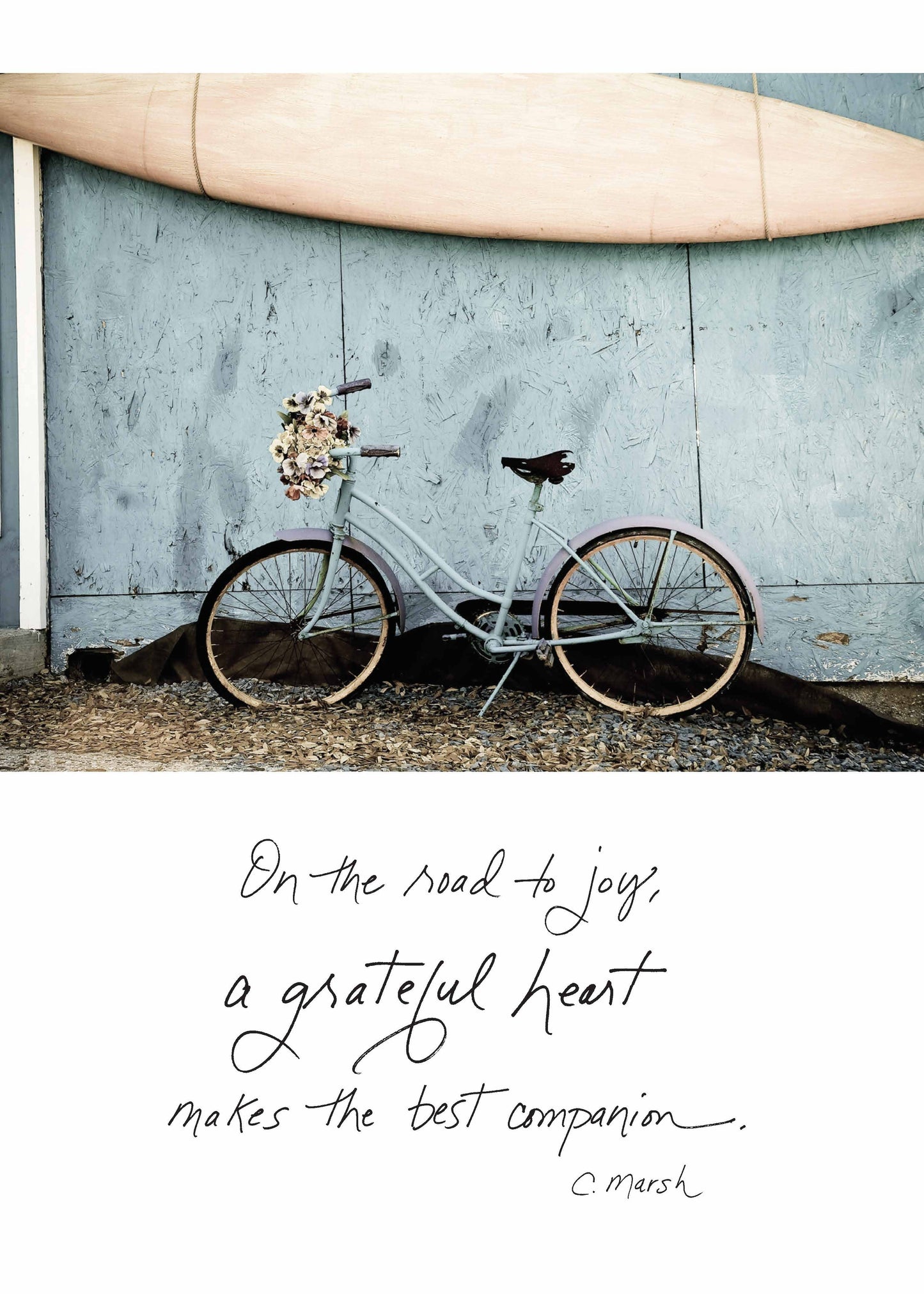 Bicycle with flowers alongside text 'On the Road to Joy, a Grateful Heart Makes the Best Companion'; stationery store greeting card