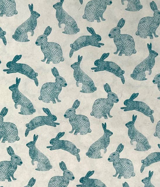 Teal bunnies pattern on cream, 20x30 stationery paper, available at stationery store.