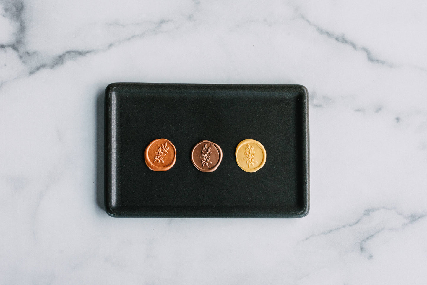 Leaf Sprig Wax Seal Stamp set by Modern Legacy Paper Company displayed on a tray, available at our stationery store.