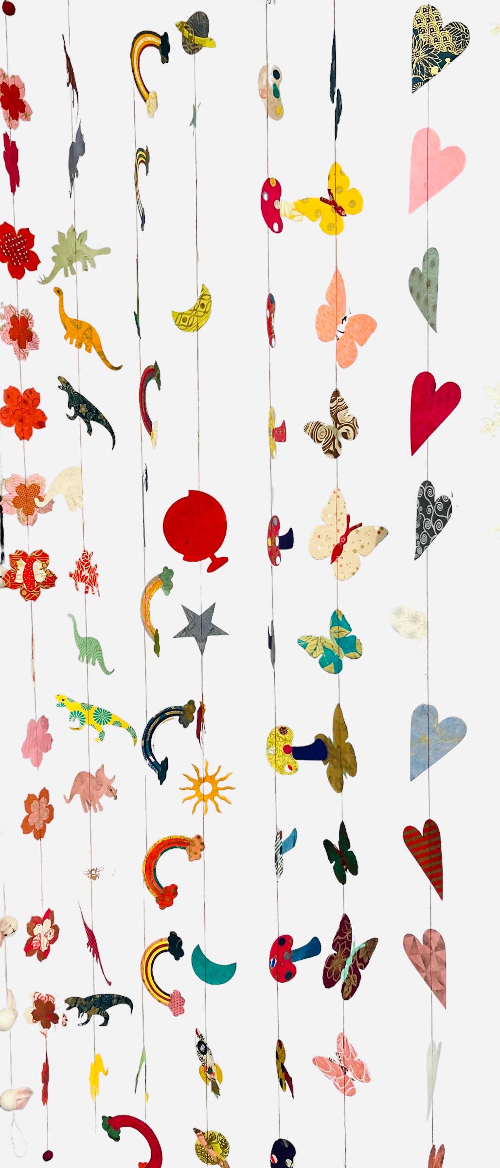 Colorful 5ft paper garland with hot air balloons, handcrafted from eco-friendly Lokta paper, available at Giftsland stationery store.