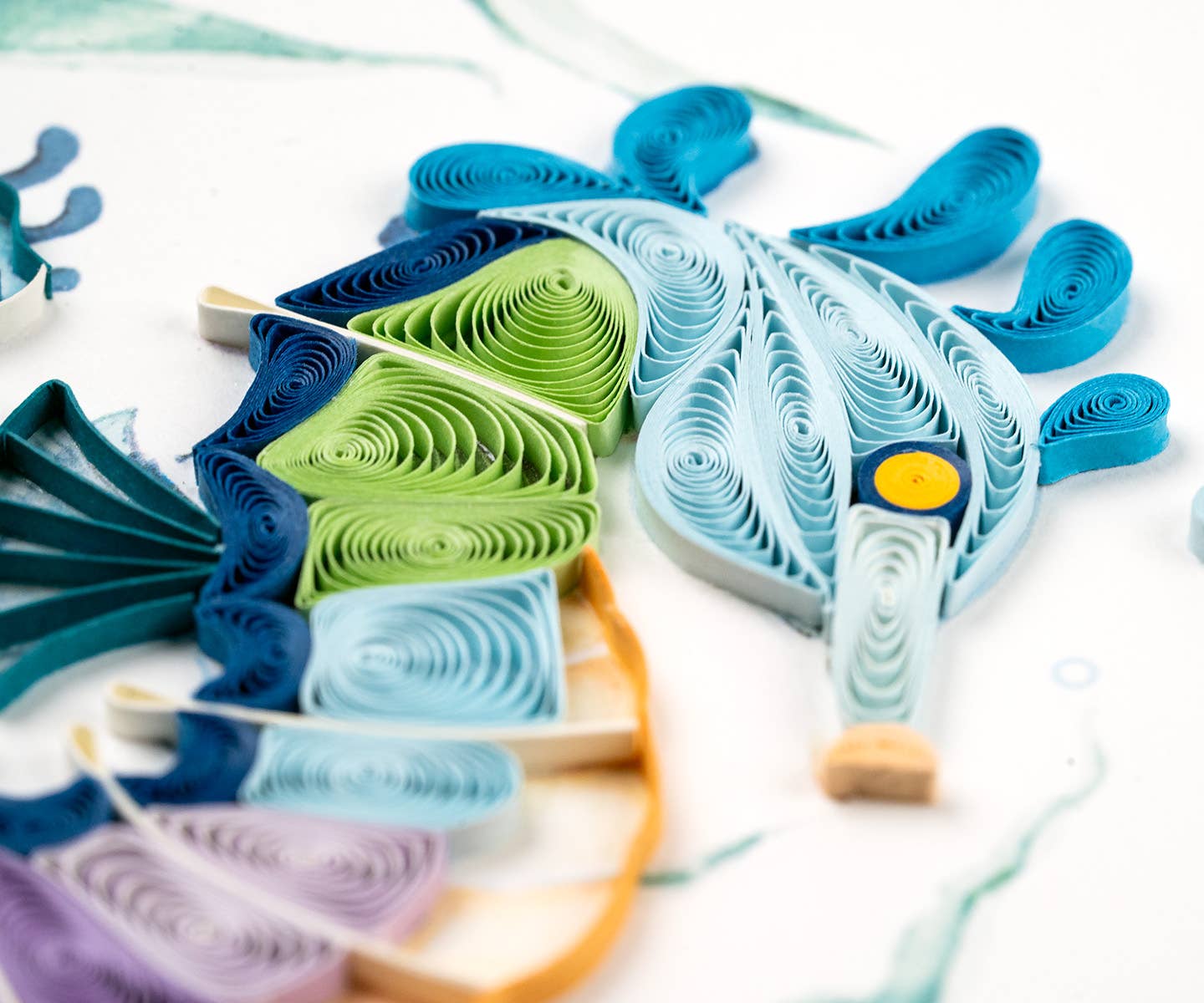 Colorful quilled seahorse greeting card from stationery store, featuring blue to purple handcrafted design by skilled artisans.