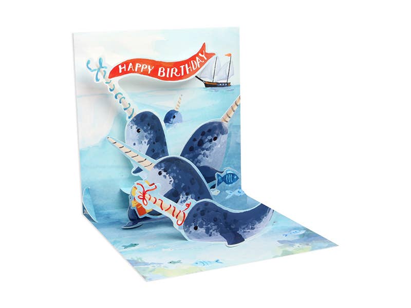 Narwhals Pop-Up Birthday Card with colorful ocean scene, glitter detail, perfect for stationery store aficionados seeking unique greetings.