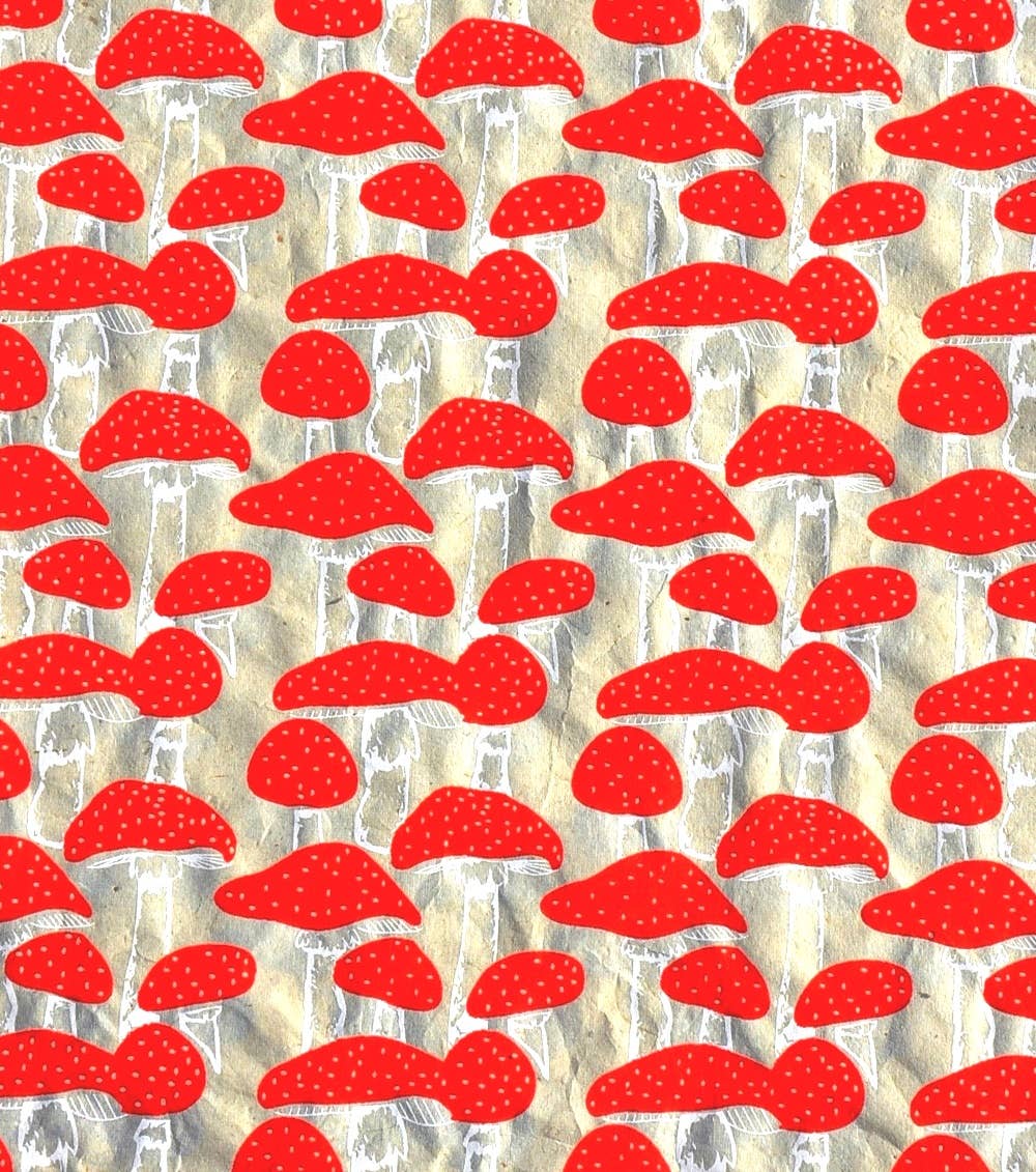 GSP455-08 mushroom wrapping paper in red and gold, eco-friendly Daphne Lokta design, ideal for gifts, available at Giftsland stationery store.