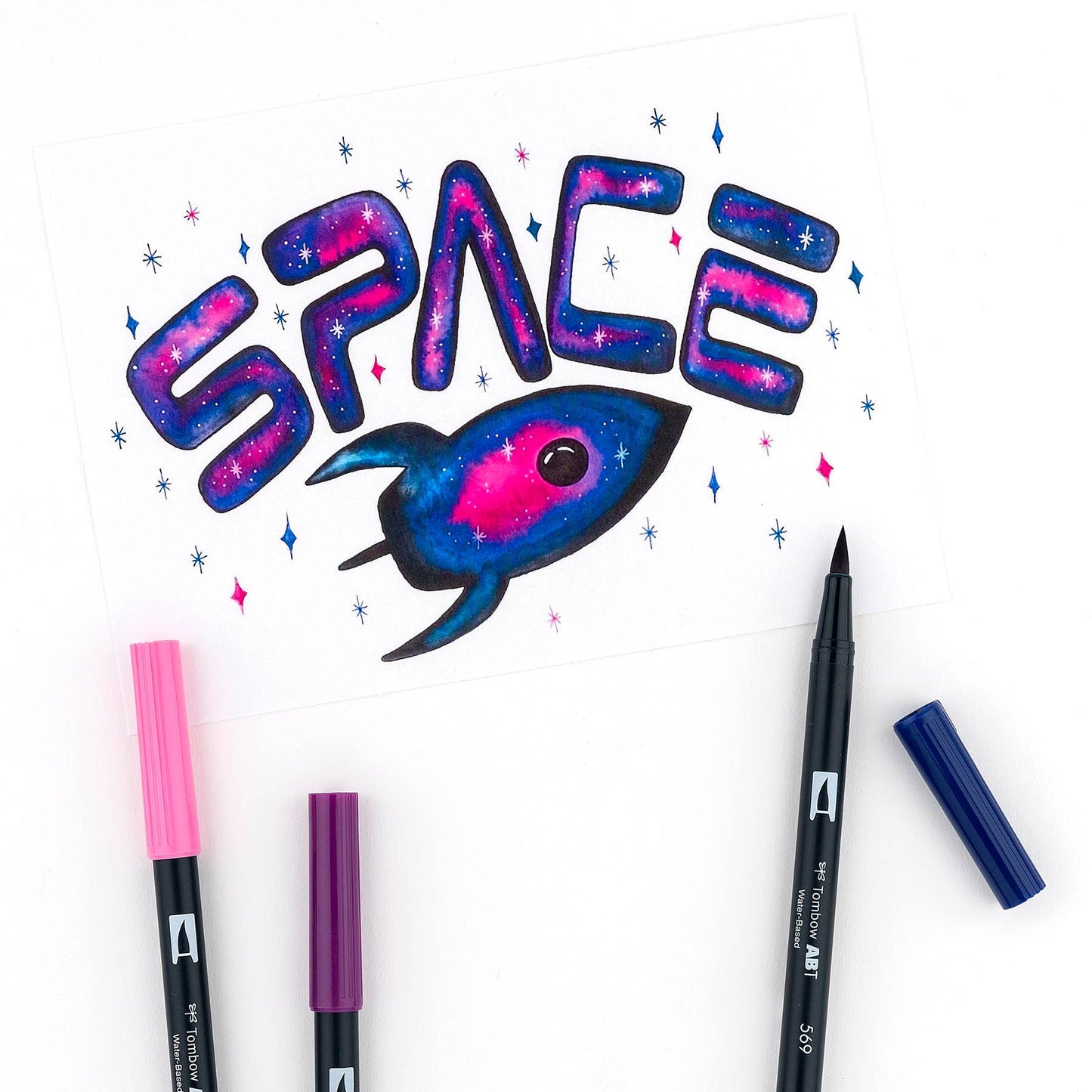 Art created with Dual Brush Pen Art Markers: Galaxy 10-Pack, featuring a rocket design, available at stationery store.