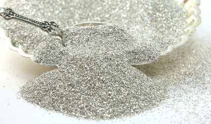 Silver Sparkly German Glass Glitter 90 Grit, perfect for stationery store crafts, showcasing fine 25g silver-coated sparkle in a dish.