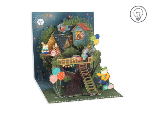 Birthday Treehouse Pop-up Card with Lights featuring colorful artwork and pop-ups. Perfect for sending wishes. From a stationery store.