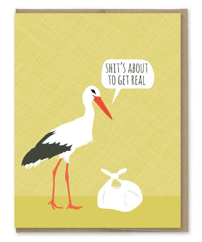 A2 Stork card with "Shit's About to Get Real" text, part of stationery store collection. Printed in USA on recycled paper with kraft envelope.