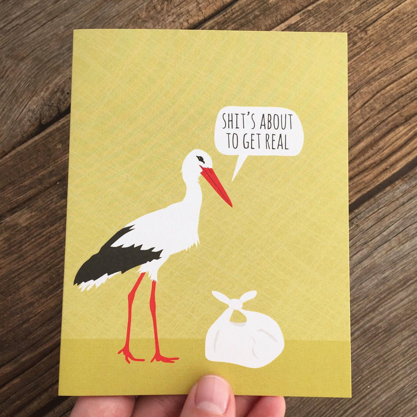 "Shit's About to Get Real" stork card featuring a stork illustration, perfect for stationery store, eco-friendly greeting card with envelope.