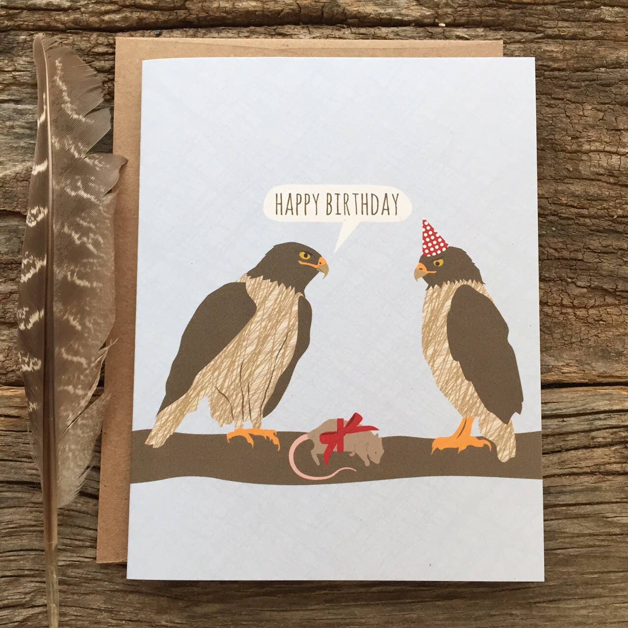 Hawks Birthday Card with festive hawk design, paired with a recycled brown kraft envelope, from a stationery store.