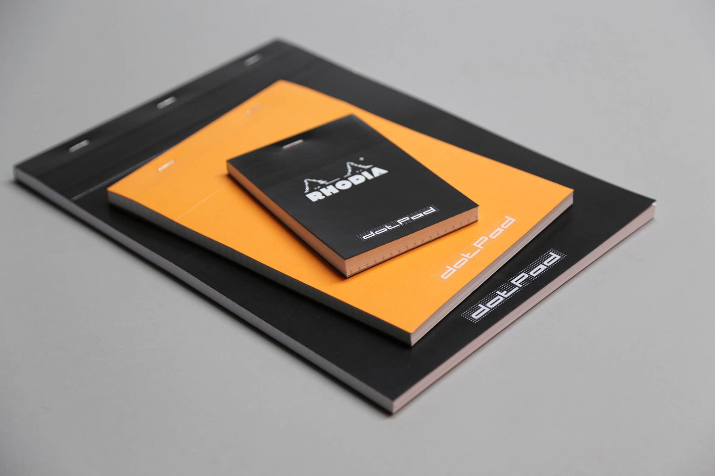 Rhodia Classic Notepad 4 x 6 with French-milled paper in orange and black. Available at stationery store. Ideal for sketching and writing.