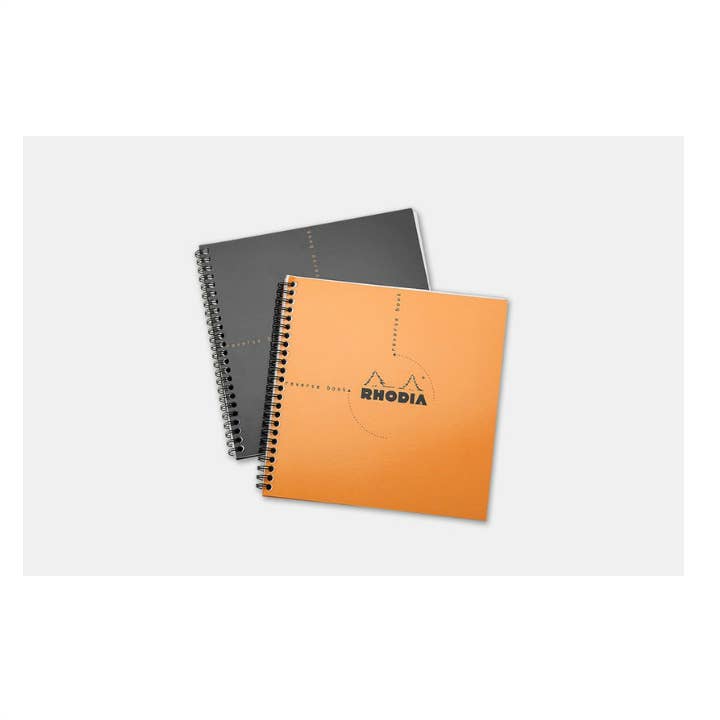 Rhodia Reverse Book 8.25 x 8.25 square notebooks with orange and black covers, spiral bound, available at stationery store.