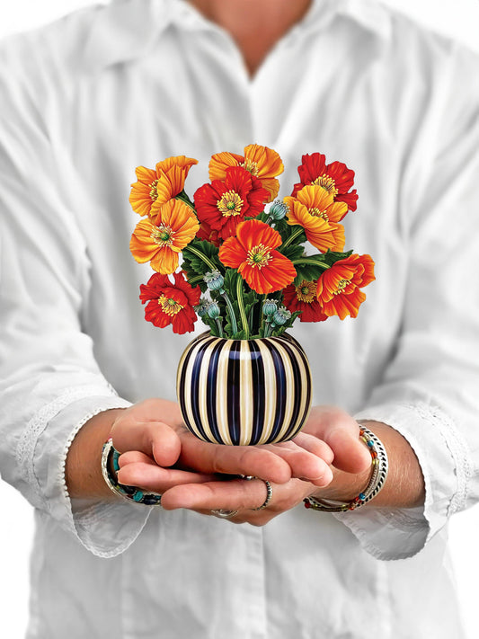Mini French Poppies pop-up greeting card in striped vase held in hands, ideal gift from stationery store, vibrant tangerine and red hues.