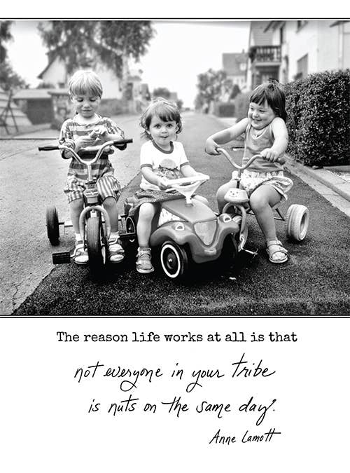 Vintage photo of kids on toy cars with Anne Lamott's quote about life and tribe, available at stationery store.