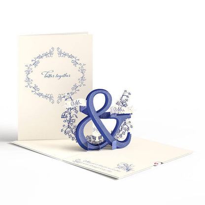 Better Together Mr & Mrs pop-up wedding card, 5''x7''. Elegant design with floral accents, perfect for weddings. Available at stationery stores.