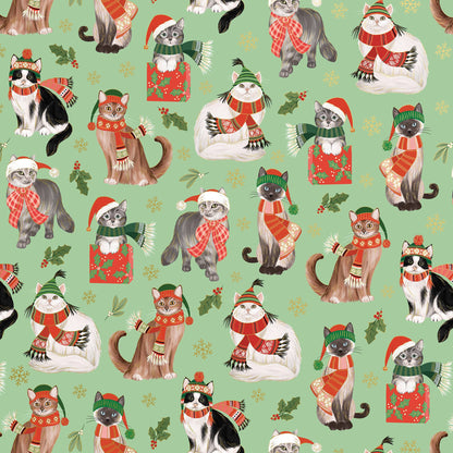 Festive wrapping paper featuring frolicking felines in holiday attire, ideal for Christmas gifts. Available at stationery stores.