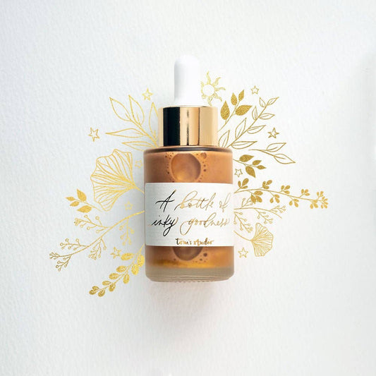 Gold calligraphy ink bottle with pipette from a UK stationery store, featuring gold foiled label and floral design, 30 ml acrylic ink.