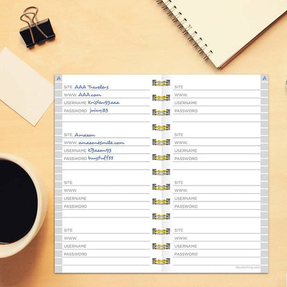 Open Black Spiral Password Book with lined sections for website, URL, username, and password. Available at our stationery store.