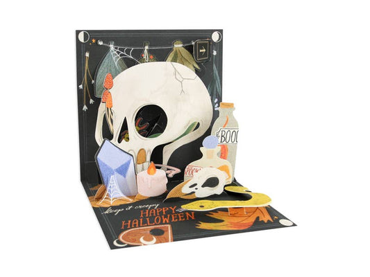 Halloween Skull Pop-Up Card with spooky elements, perfect for Halloween greetings. Available at stationery stores. 5.25" x 5.25".