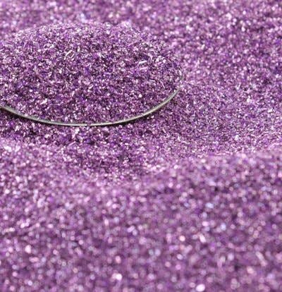 Lilac sparkly German glass glitter, fine 90 grit, 25g, for stationery store crafts and art projects, vivid purple close-up view.