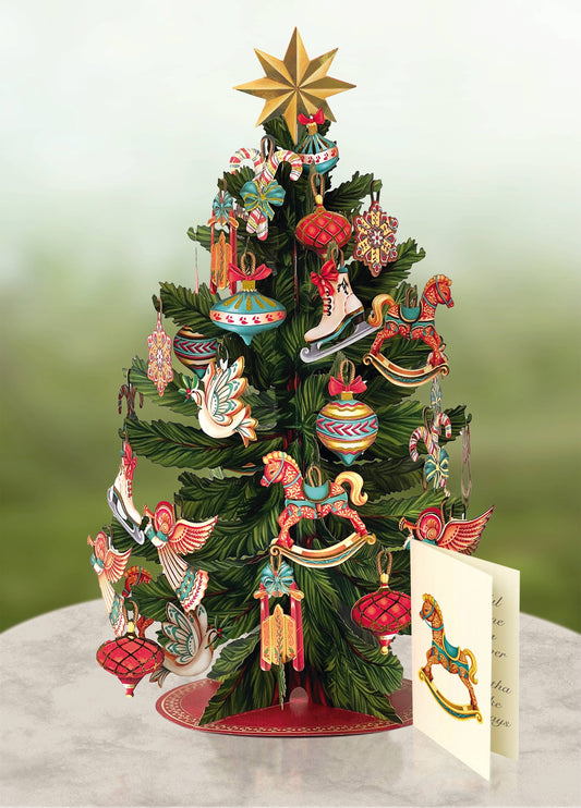 Christmas Tree Pop-up Holiday Greeting Card with ornaments and notecard, made from recyclable paper, available at stationery store.