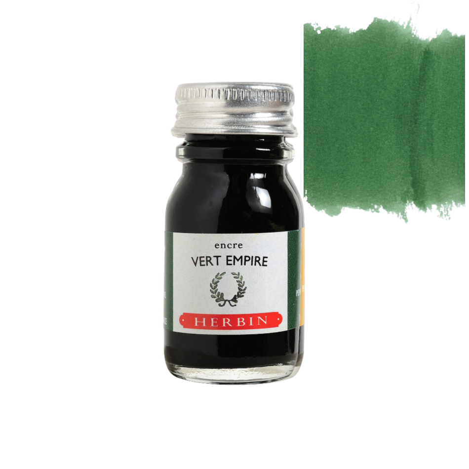 Close-up of a hand holding a Herbin Bleu Pervenche fountain pen ink 10ml bottle, elegant stationery from Paris, available in 35 colors