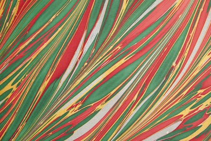 Hand Marbled Christmas Wrapping Paper with red, green striations from stationery store, 100% recycled cotton, festive design.