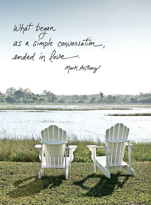 Anniversary card featuring two chairs by a lake with "What Began as a Simple Conversation, Ended in Love" by Mark Anthony, stationery store.