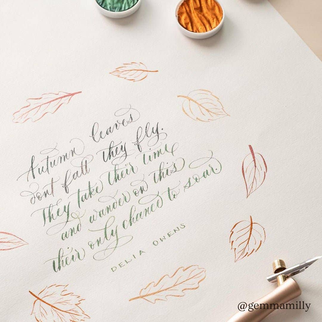 Elegant calligraphy with Flourish Calligraphy Pen, featuring autumn leaves design. Available at stationery stores. Perfect for artistic expression.