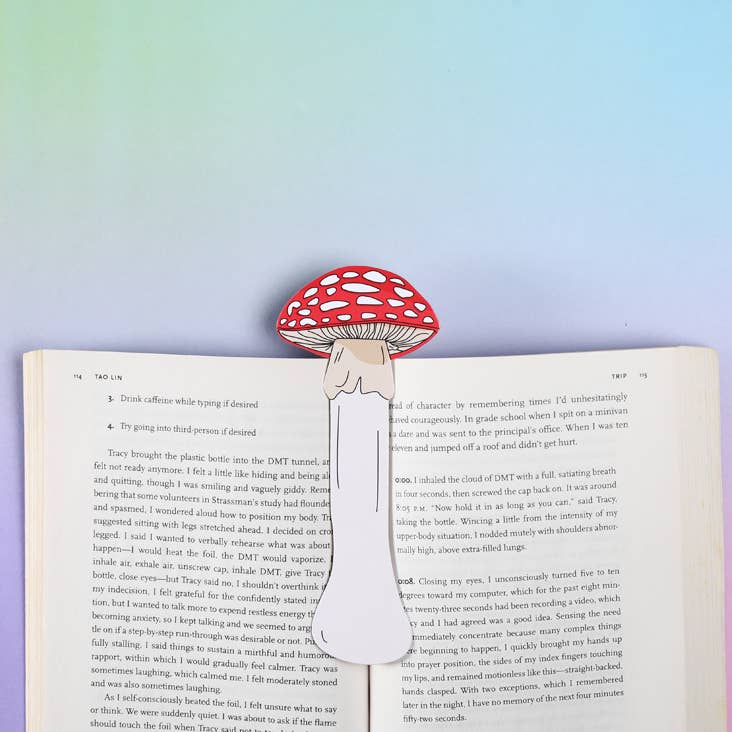 Red and white die-cut mushroom bookmark in book, perfectly paired for any stationery store. Features non-fading UV inks and sturdy paper.