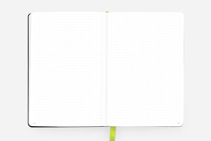 Open view of the Daily Planner - Undated - Cosmic Blue from a stationery store, featuring blank pages with a lime green ribbon bookmark.