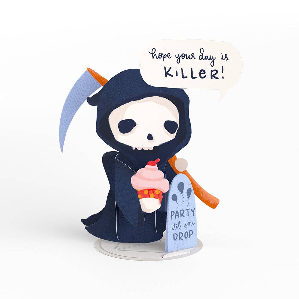 Happy Birthday Grim Reaper card with pop-up character holding ice cream and saying 'Hope your day is killer.' Available at stationery store.