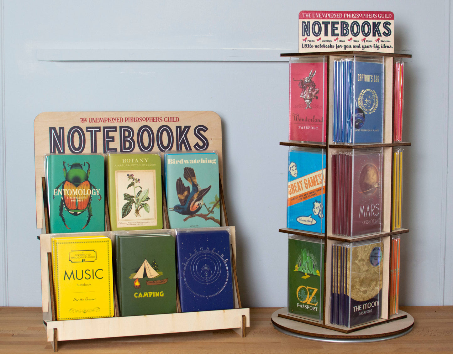 Display of various themed notebooks including Botany Naturalist's Notebook at a stationery store.