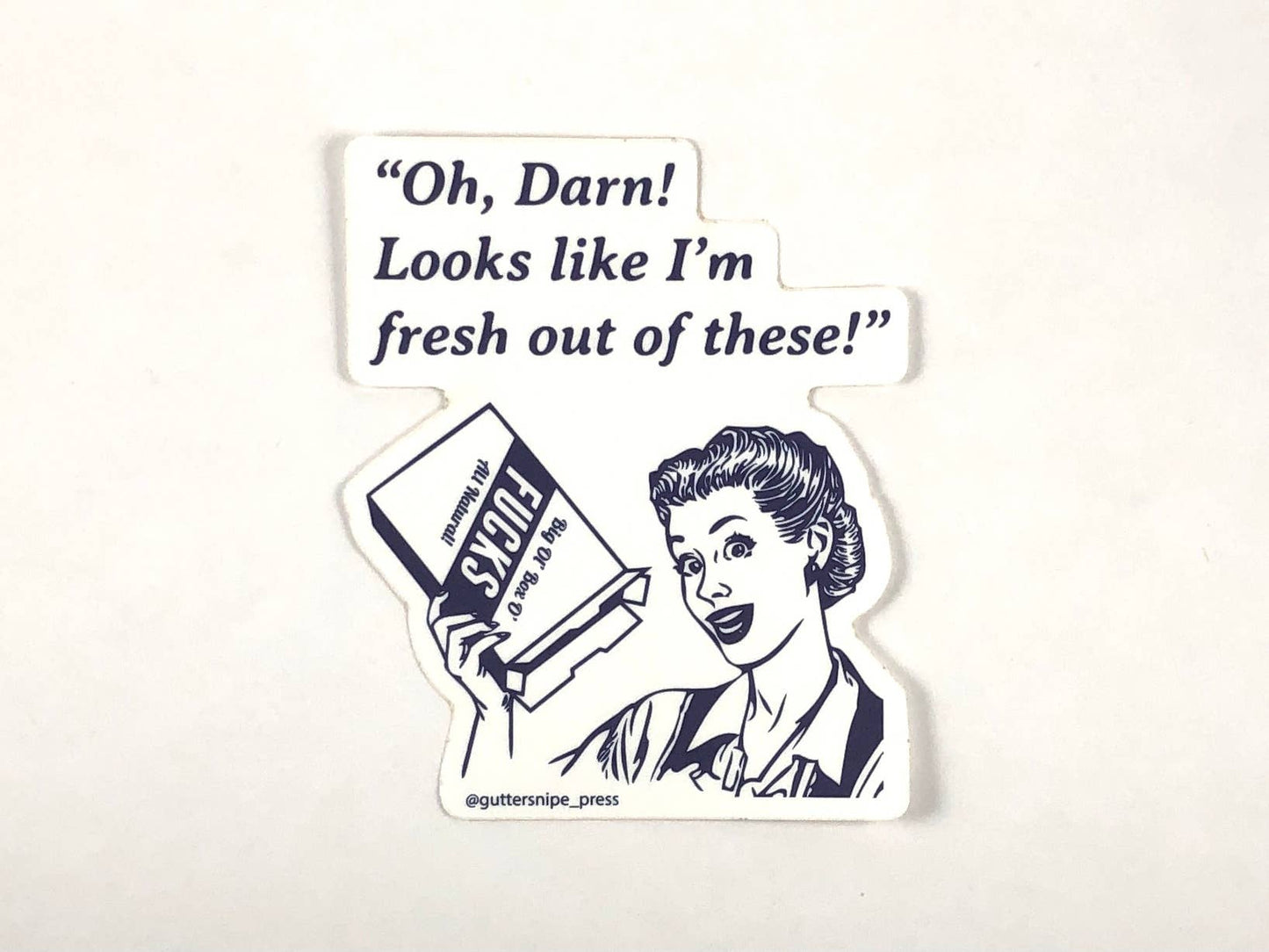 Vintage-style 'Fresh Out' vinyl sticker with retro woman holding baking soda box, popular at stationery stores. Measures 3x4 inches for indoor/outdoor use.