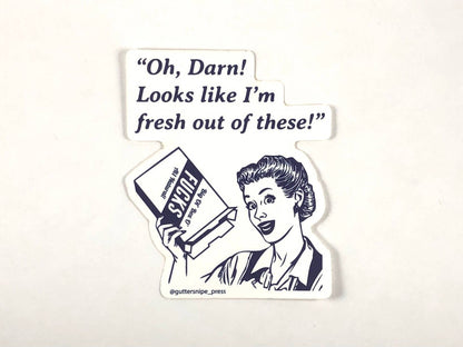 Vintage-style 'Fresh Out' vinyl sticker with retro woman holding baking soda box, popular at stationery stores. Measures 3x4 inches for indoor/outdoor use.