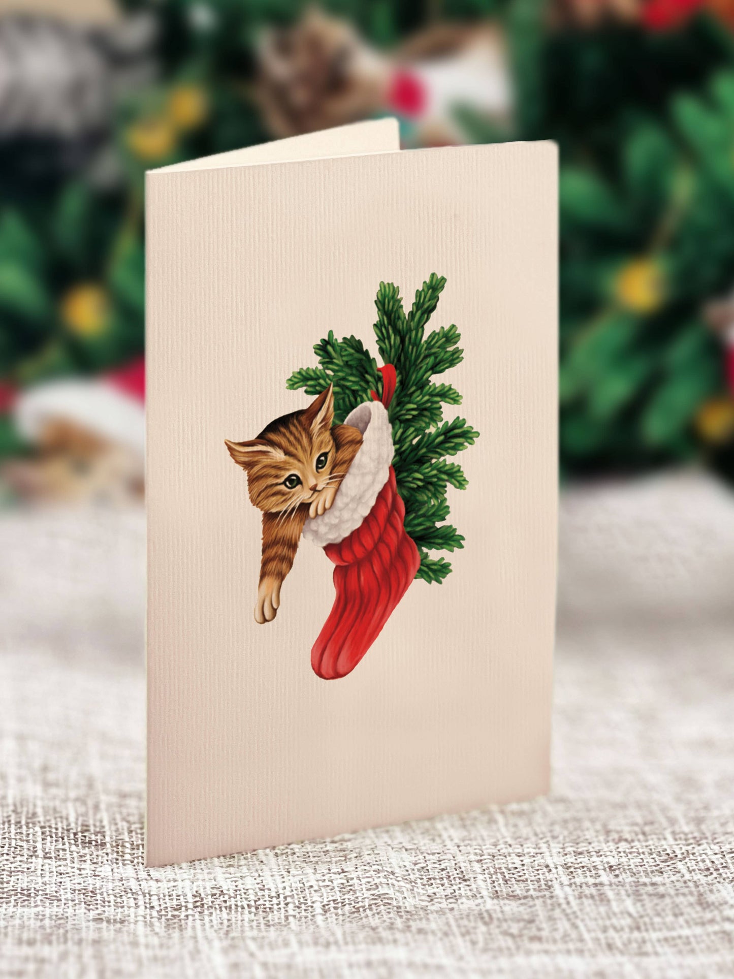 Mini Meowy Christmas Tree pop-up greeting card featuring a kitten in a stocking, perfect for a stationery store Christmas gift.