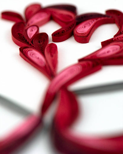 Quilled card showing red heart made of swirling patterns, from the 'A Toast to Love' collection by a stationery store.