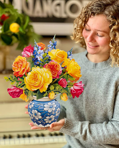 Sorbet Roses Pop Up Card with vibrant roses in blue vase, showcased at stationery store.