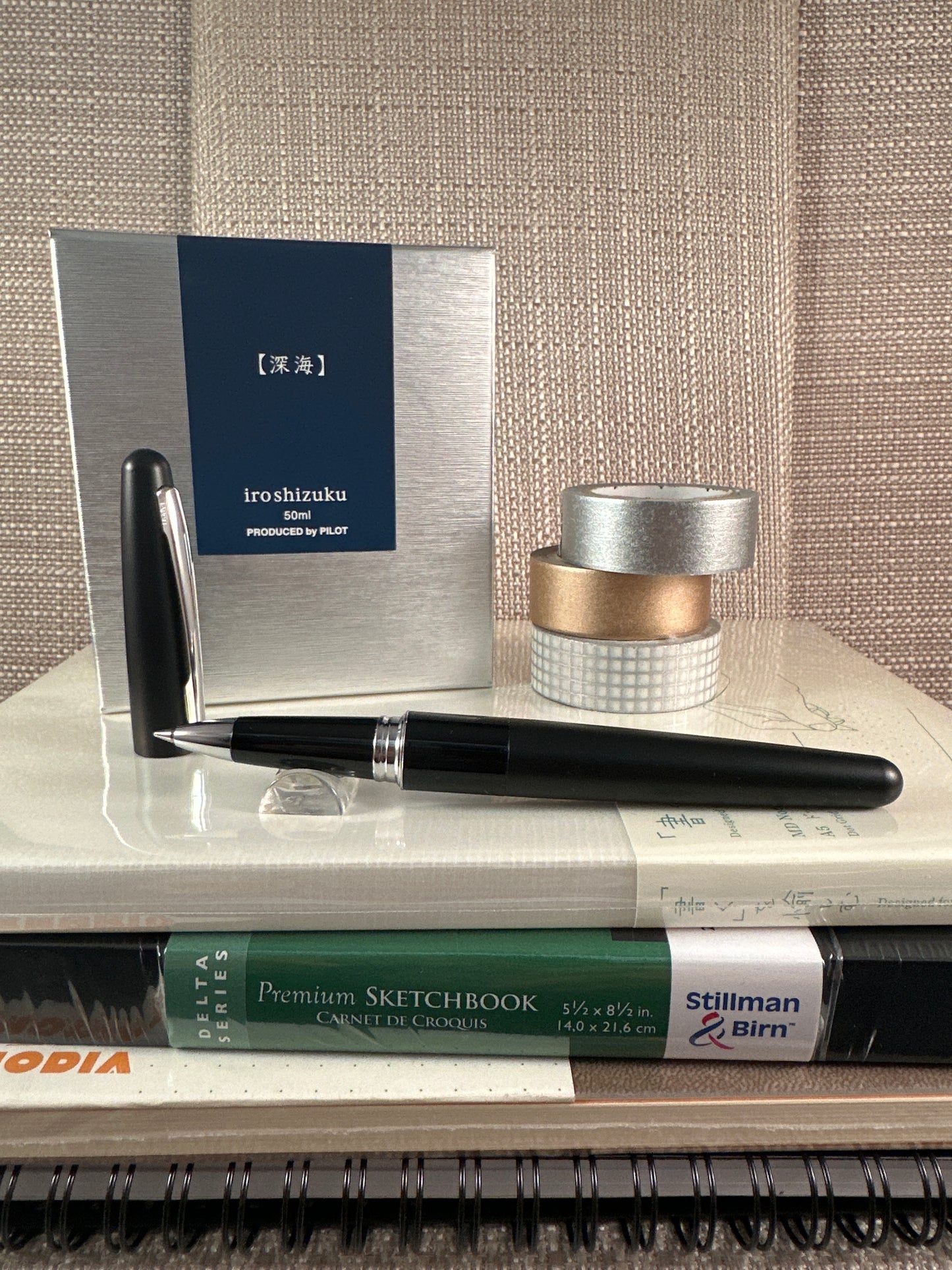 Pilot Metropolitan Rollerball Pen with sketchbook and stationery supplies in a store display