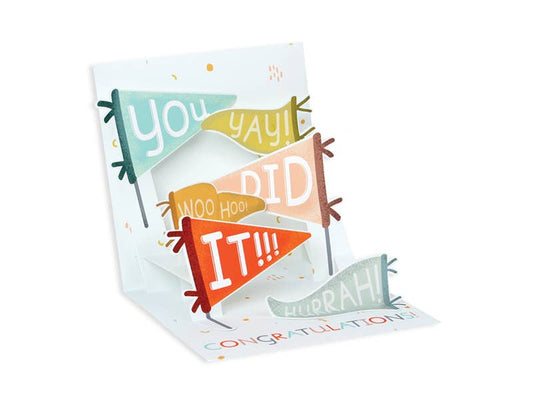 Congratulations Flags Pop-Up Card with colorful banners, perfect for celebrations. Available at stationery store.