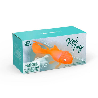 Koi Toy light-up goldfish bath & pool toy in a colorful box, ideal for stationery store shelves. Glows in water, BPA-free silicone.