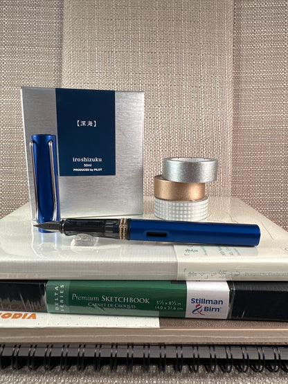 LAMY AL-star Fountain Pen displayed with stationery accessories at a stationery store.