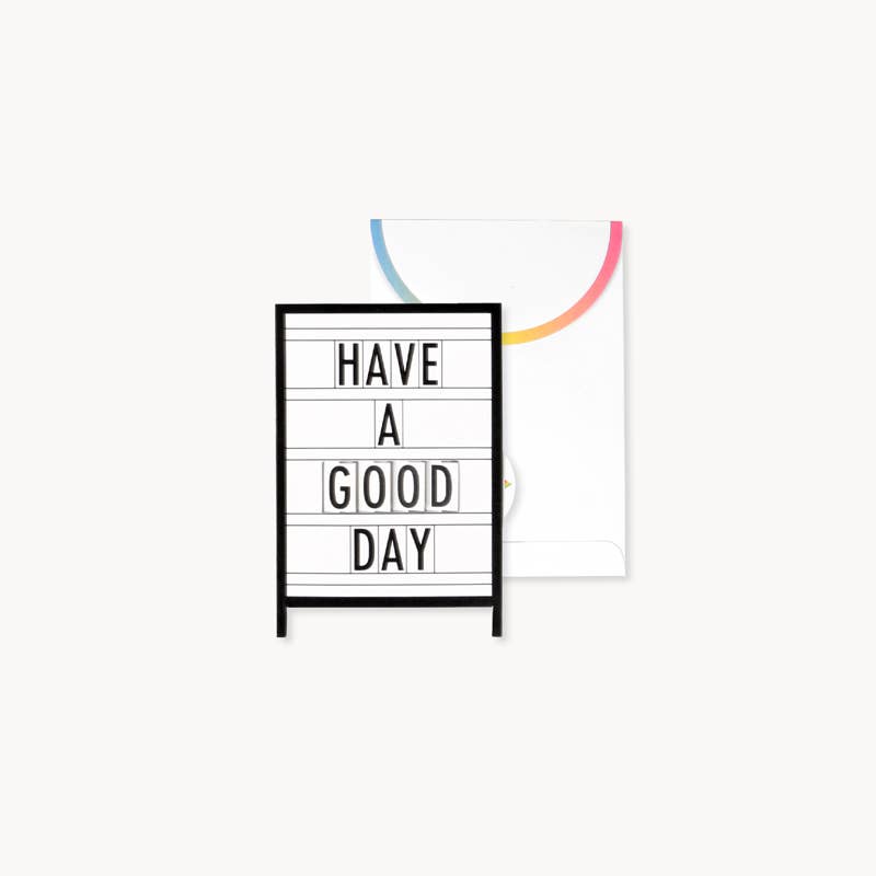 Marquee Pride Pop-Up Card with rainbow flap envelope from stationery store, displaying 'Have a Good Day' message.