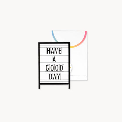 Marquee Pride Pop-Up Card with rainbow flap envelope from stationery store, displaying 'Have a Good Day' message.