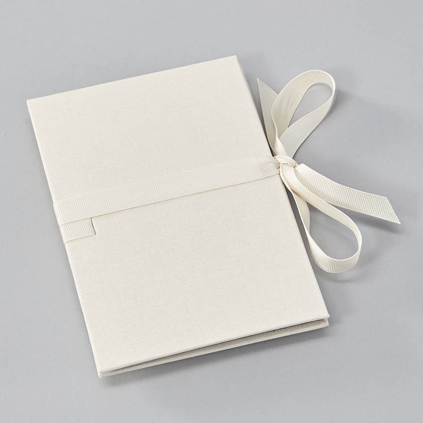 Heritage Line - Leporello Wedding Edition photo album with linen cover and ribbon, available at stationery stores for memorable events.