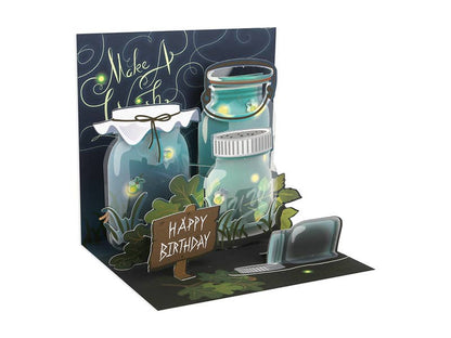 Lightning Bugs Pop-Up Card with glowing jars and 'Make A Wish' message, available at stationery store. Perfect for birthdays.