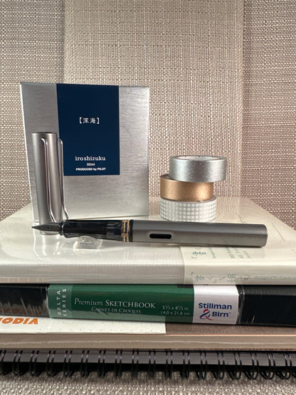 LAMY AL-star Fountain Pen with ink at a stationery store, perfect for comfortable writing and calligraphy.