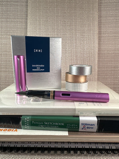 Lamy Al-Star Fountain Pen Special Edition Lilac with accessories, available at stationery store, perfect for collectors and beginners.