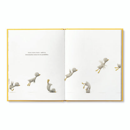 Open page from the book 'Finding Muchness' at a stationery store, featuring illustrations of playful birds.