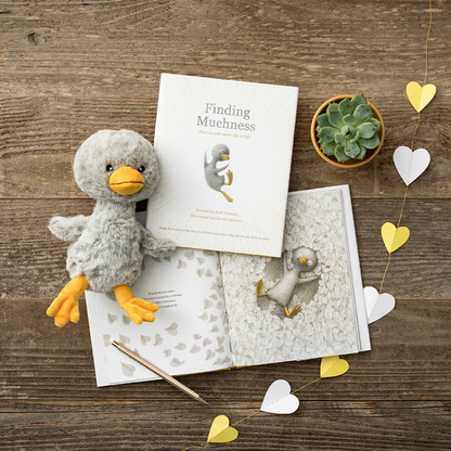 Book 'Finding Muchness' with duck plush and stationery, perfect for stationery store collections.